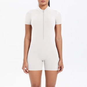 Detailed view of white short sleeve yoga jumpsuit with secure front zipper and slim fit