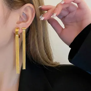 Elegant gold-tone long fringe tassel ear cuff earrings with sleek metal snake chains