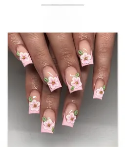 Detailed view of square fake nails featuring 3D pink flowers and green leaves decoration