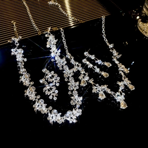 Elegant silver bridal jewelry set with sparkling floral leaf necklace and drop earrings