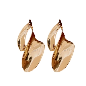 Minimalist gold leaf-shaped earrings with irregular twisted geometric design for women