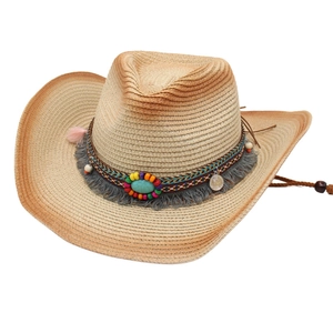 Straw cowboy hat with ethnic beaded band and turquoise stone in natural beige color