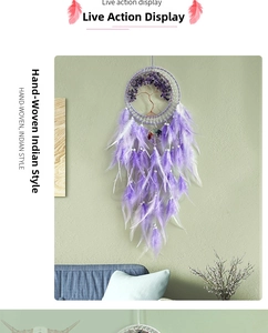 Macro detail of purple crystal tree of life dream catcher with feathers for wall hanging decor