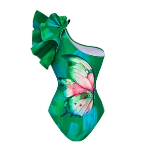 Detail of one-shoulder swimsuit featuring vibrant butterfly print and layered ruffles