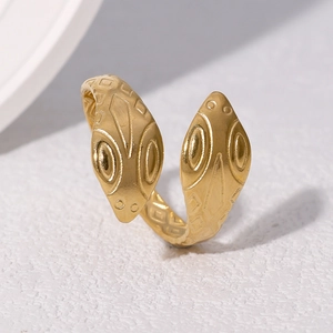 Adjustable snake-shaped stainless steel ring in 18k gold finish with geometric patterns