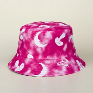 Close-up of pink tie-dye bucket hat with white mushroom, moon, and butterfly prints