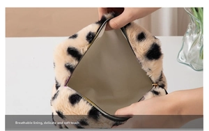 Detailed close-up of breathable soft lining inside the plush leopard print makeup bag
