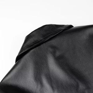 Close-up of the black faux leather coat collar showing premium grain and texture