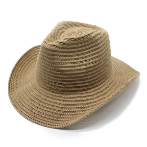 Close-up of khaki woven knit cowboy hat showing detailed high-density texture and wide brim