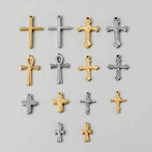Detailed arrangement of 14 vintage stainless steel cross pendants in gold and silver finish