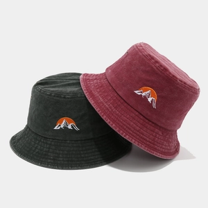 Washed cotton bucket hats in dark grey and burgundy with sun embroidery for outdoors