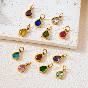 Set of 12 teardrop birthstone pendants with 18K gold plating on textured white stone