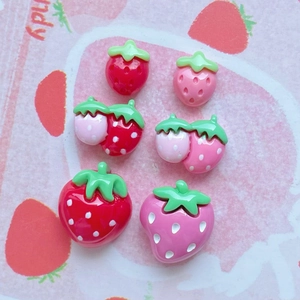 Macro shot of 6 pieces red and pink resin strawberry charms for DIY jewelry making