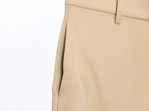 Close-up of khaki twill pants showing reinforced side pocket and belt loop stitching