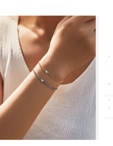 Close-up of minimalist S925 silver curb chain bracelet with sparkling round moissanite stone