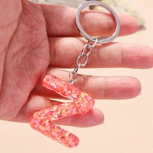 Letter Z resin keychain with orange-pink sequins and silver ring for accessories