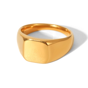 Detailed macro view of a 18k gold plated stainless steel square signet ring with glossy finish