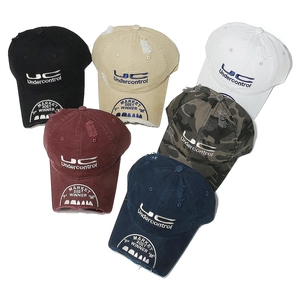 Group view of six distressed cotton baseball caps with embroidery and ripped details