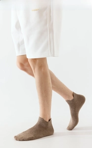 Detailed close-up of brown low-cut socks featuring a seamless toe for enhanced comfort
