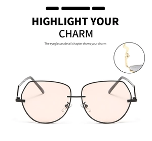 Detail of pink lens aviator sunglasses with a gold Z-shaped metal hinge design