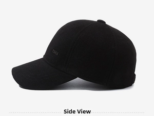 Side view detail of black winter baseball cap showing thick corduroy texture and fine stitching