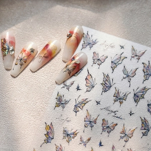 Elegant gold-foiled butterfly nail stickers with watercolor gradient Aurora glass effect
