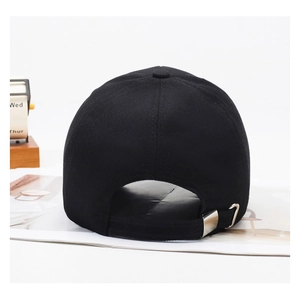 Detail of adjustable silver metal buckle on black cotton baseball cap back view