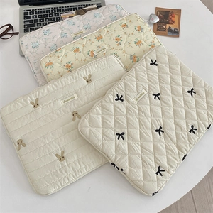 Quilted floral and rabbit embroidered laptop sleeves in pink, yellow and beige styles