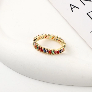 Minimalist gold plated eternity ring featuring rainbow baguette-cut colorful zircon stones