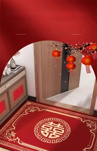 Detailed texture of red wedding rug with golden Xi character and anti-slip TPR backing