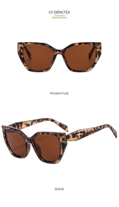 Detail view of retro cat eye sunglasses in demi tortoiseshell frame and tea lenses
