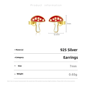 Macro shot of S925 sterling silver mushroom stud earrings with red and white enamel details