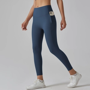 Detail showing high-waisted yoga leggings with a side pocket for smartphone storage