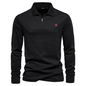 Detail of red lion embroidery and zipper collar on men's black cotton polo shirt