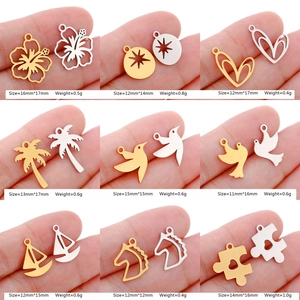 Various mirror-polished stainless steel charms featuring flowers, birds, and animals in gold and silver