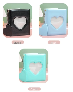 Detailed view of heart-shaped cutout mini photo albums in black, blue, and cyan colors