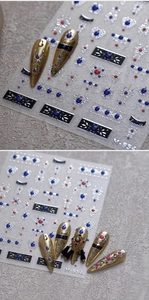 Detailed macro view of vintage M854 nail art stickers with gold and silver metallic patterns