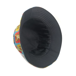 Detail view of the reversible bucket hat showing black canvas and tiger print interior