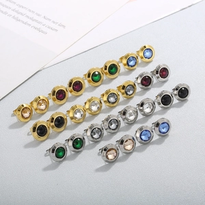 Macro view of multi-color crystal gemstones set in stainless steel earrings