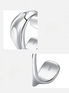 Detailed macro view showing the S925 hallmark on polished liquid metal silver ear cuff