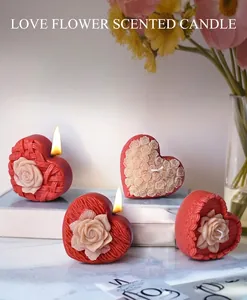 Detail of woven heart rose candle and silicone mold on elegant marble background