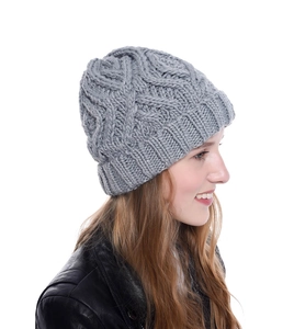 Detailed side view of a gray chunky knit beanie with diamond pattern for winter