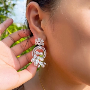 Elegant floral pearl drop earrings with sparkling cubic zirconia in a silver finish