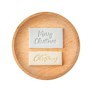 Merry Christmas rectangle cookie stamps for festive baking decoration on wooden tray