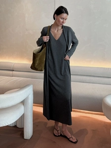 Detail of soft dark grey knitted cardigan and slim maxi dress set for women in autumn