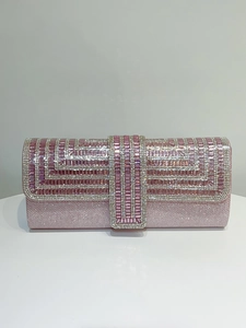Close-up of pink rhinestone evening clutch with intricate geometric beadwork pattern