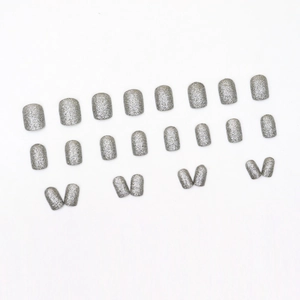 Short silver glitter press-on nails with shiny sequin finish in square oval shape