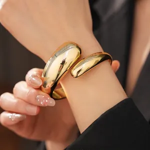 Polished gold textured wrap bracelet with a minimalist crisscross design for women