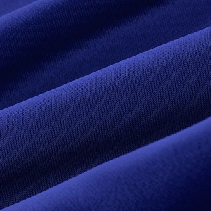 Macro shot of blue knitted plaid fabric texture on men's casual straight trousers