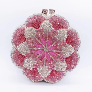 Detail of rose-shaped evening clutch with pink and silver rhinestones and metal buckle